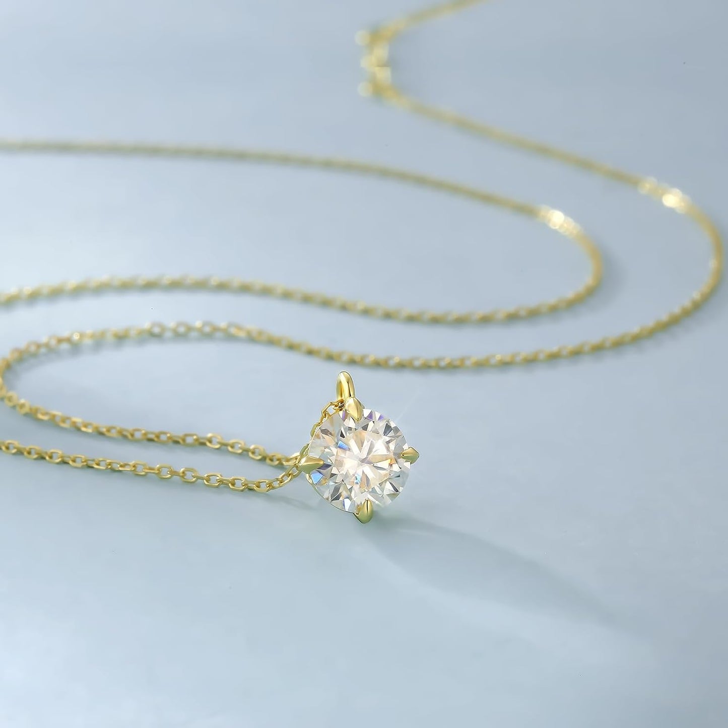 14K gold solitaire necklace featuring a sparkling round gemstone on a delicate chain
