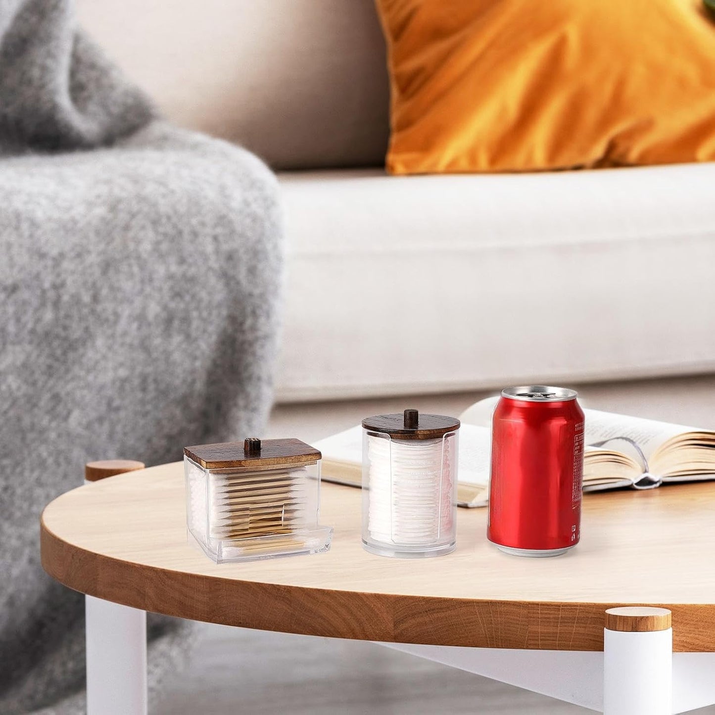 Elegant cotton ball storage organizer in clear canisters on a coffee table for stylish home decor