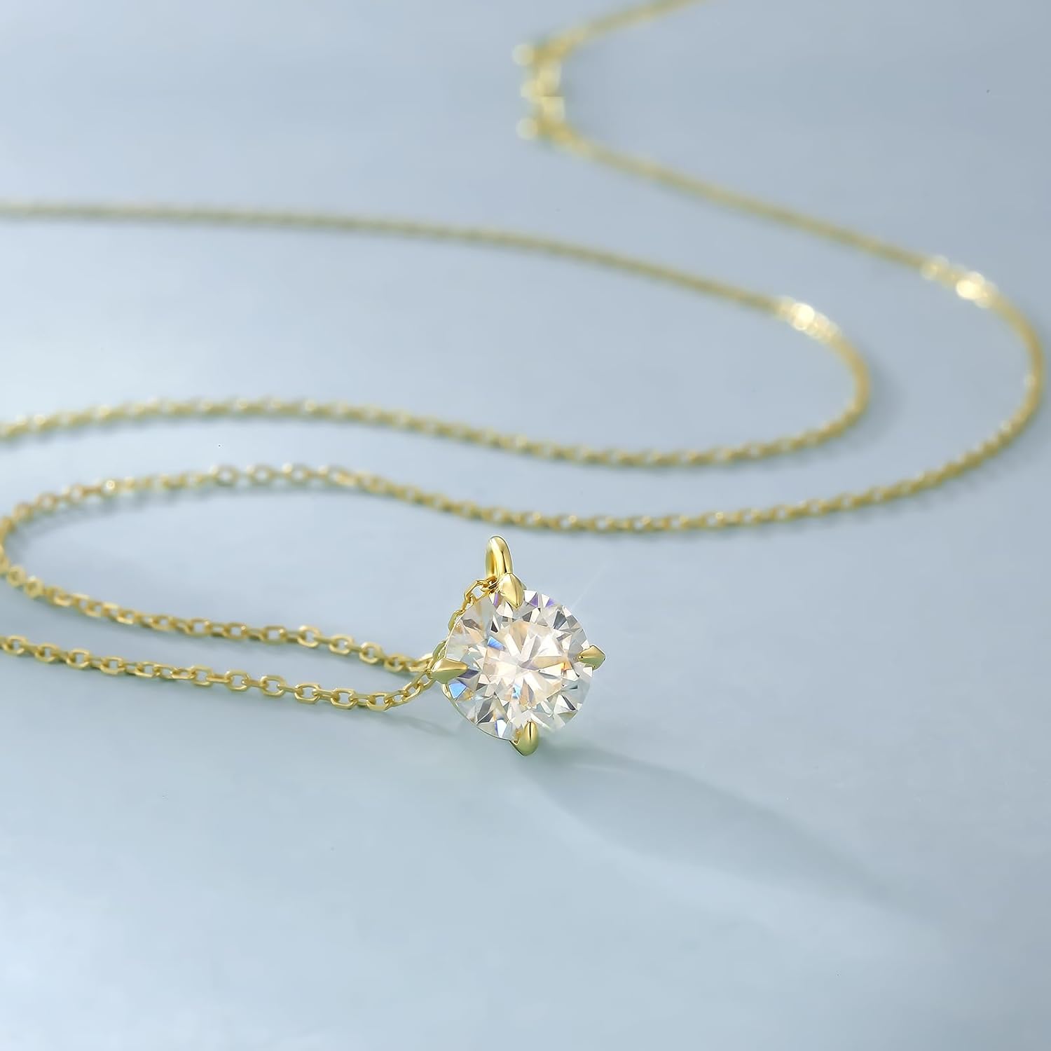 14K gold solitaire necklace featuring a sparkling round gemstone on a delicate chain