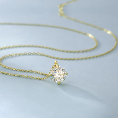 14K gold solitaire necklace featuring a sparkling round gemstone on a delicate chain